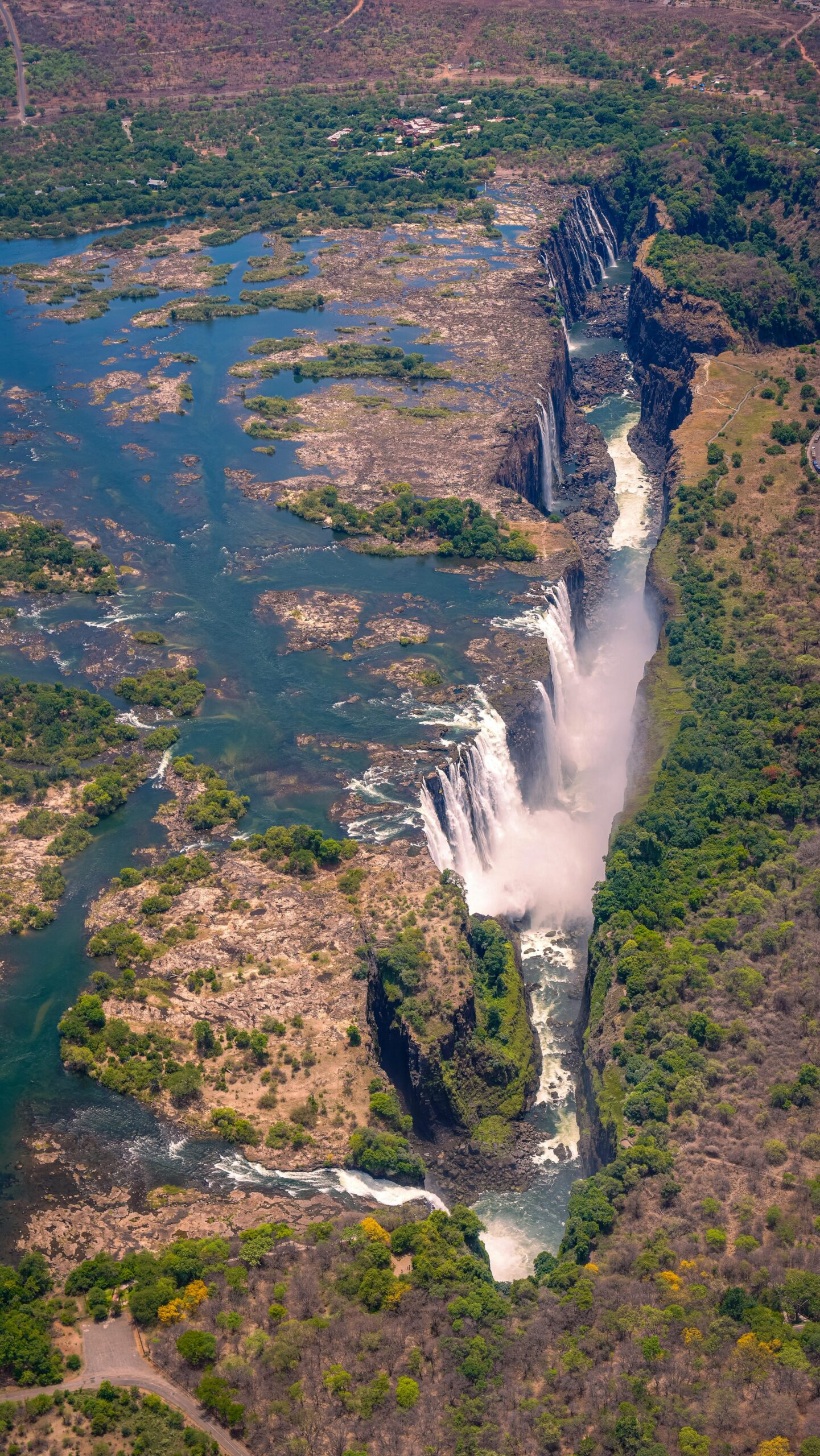 Stunning aerial shot of Victoria Falls, showcasing its breathtaking beauty and surrounding landscape.